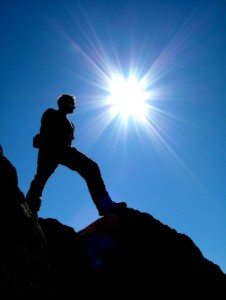 Silhouette Of A Man On A Mountain Peak