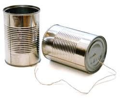 Two Tin Cans Connected By String.