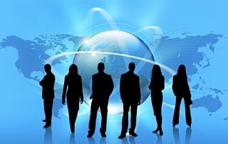 6 Business People Silhouettes Standing In Front Of Blue Globe & Map