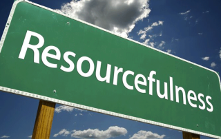 Green And White Road Sign With Resourcefullness on it with a blue sky and clouds