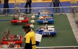 Picture of Robots On Field And Team Cheering