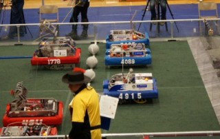 Picture of Robots On Field And Team Cheering