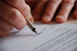 Person Signing a Document