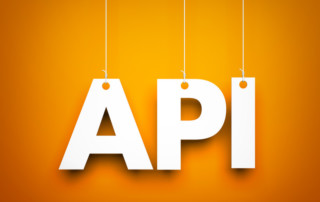 The Letters API Hang from String On an Orange Background