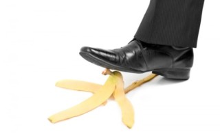 A Persons Foot About To Step On A Banana Peel
