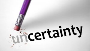 the word "un-certaintly" with a pencil