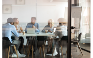 Business people negotiating at boardroom behind closed doors