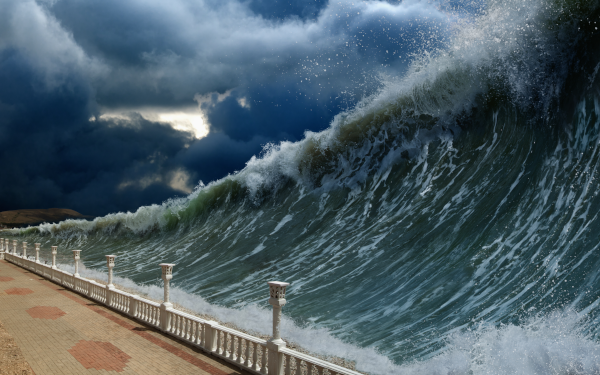 huge wave right before it breaks over railing