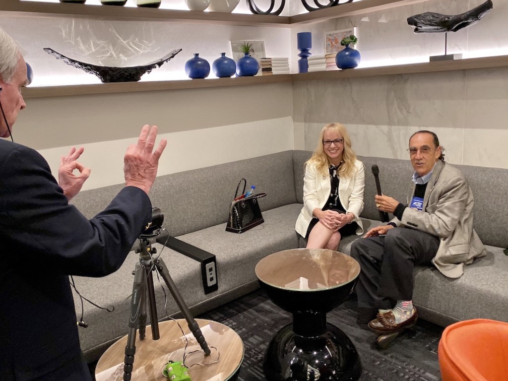 Image of Saul Interviewing Rebecca Jensen and John Reilly behind the camera