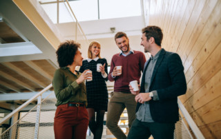 It's coffee o'clock! Group of coworkers having a coffee break