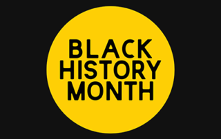 yellow circle with text reading "black history month" on black background
