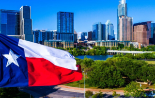 city skyline in texas with the texas flag in the foreground