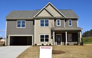 House for sale under contract sign in front