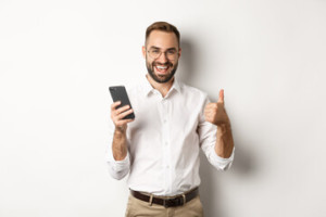 satisfied man holding phone