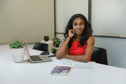 Girl smiling at desk