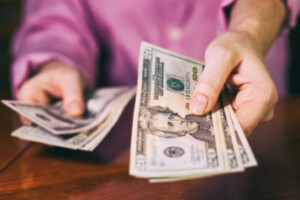 handing cash over