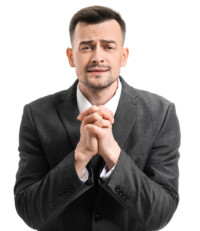 Portrait of apologizing businessman on white background